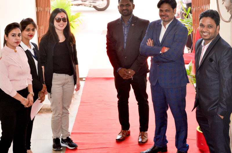 Members of the GLBAI Solutions team standing together at an entrance